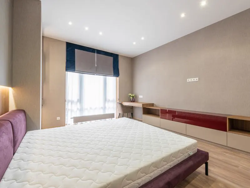 Bare mattress in a bedroom, a common place for bed bugs to hide
